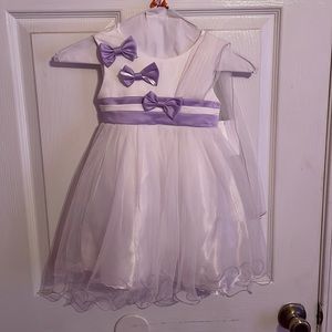 Toddler girls purple and white tulle dress. Zip closure. Purple satchel